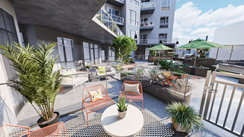 A patio area with tables and chairs and a building in the background